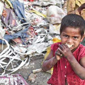 A nutrition deprived child eating food