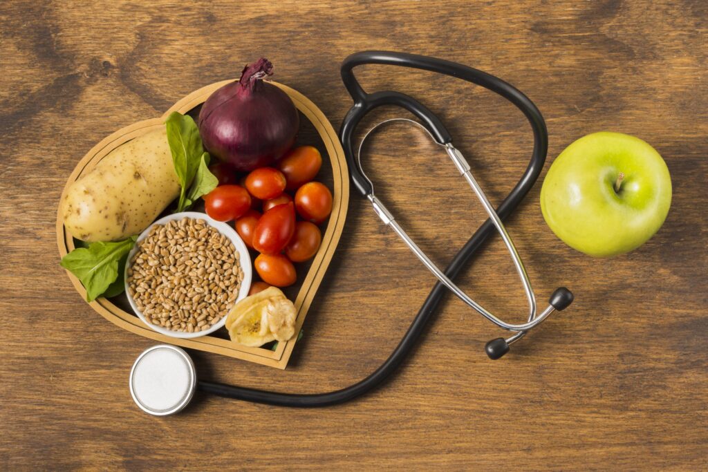vegetables fruits and a stethoscope to illustrate nutrition assessment