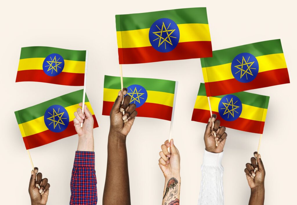 Hands waving flags of Ethiopia