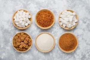 Bowls of table sugar in various forms