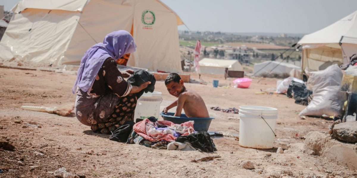 A mother and her son in a refugee camp