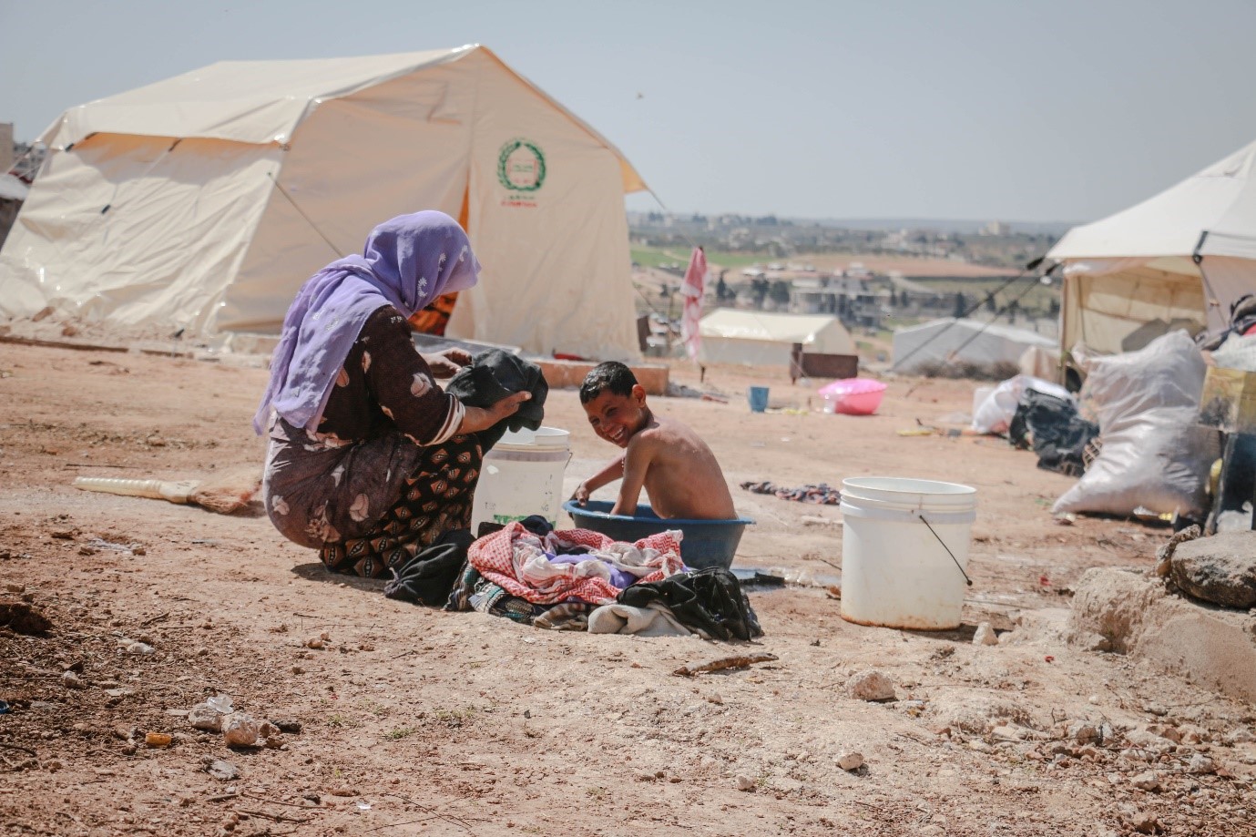 A mother and her son in a refugee camp