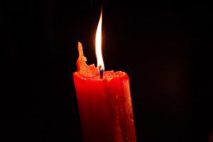 A red candle lit in commemoration of World AIDS Day