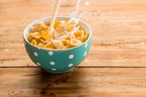 Cereal in a bowl served with milk as a source of calcium
