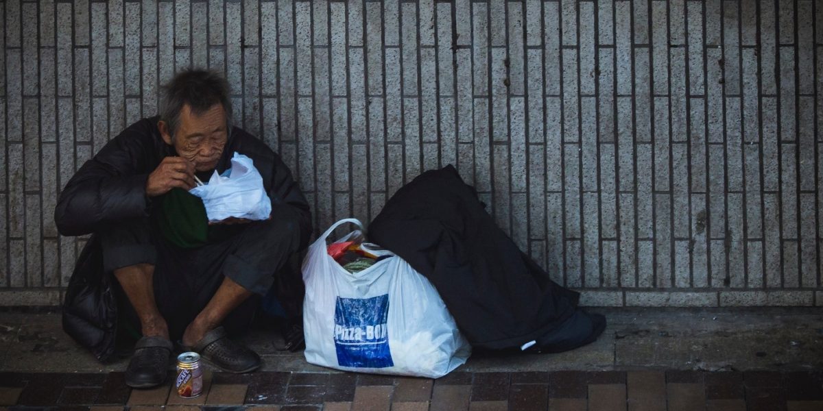 a homeless person having a meal