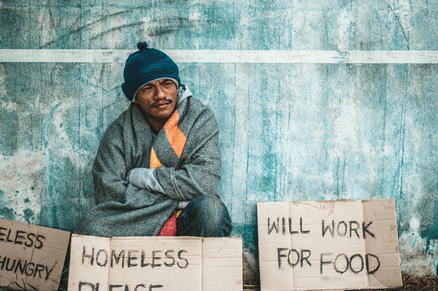 a hungry homeless person looking for work