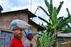 african women carrying food stuff home